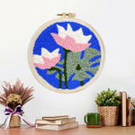 Finished pink and white lotus artwork displayed on a wall
