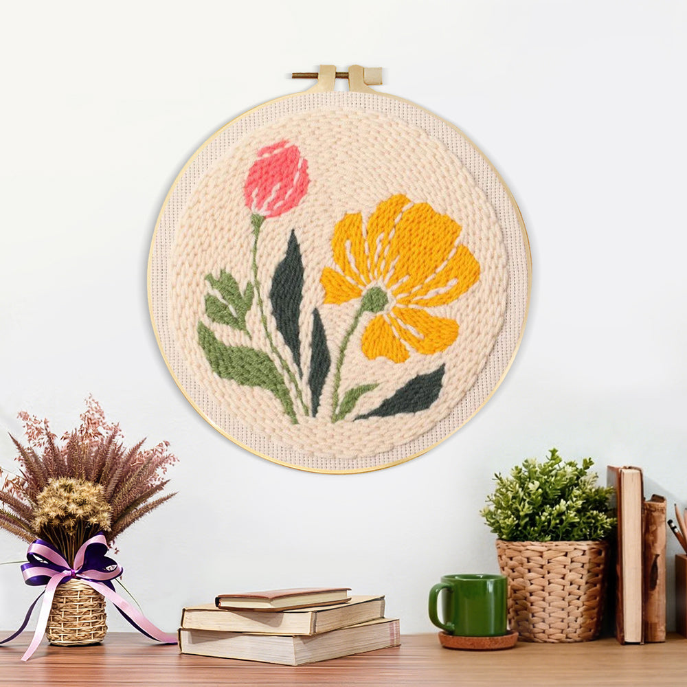 Finished pink and yellow wildflowers artwork displayed on a wall