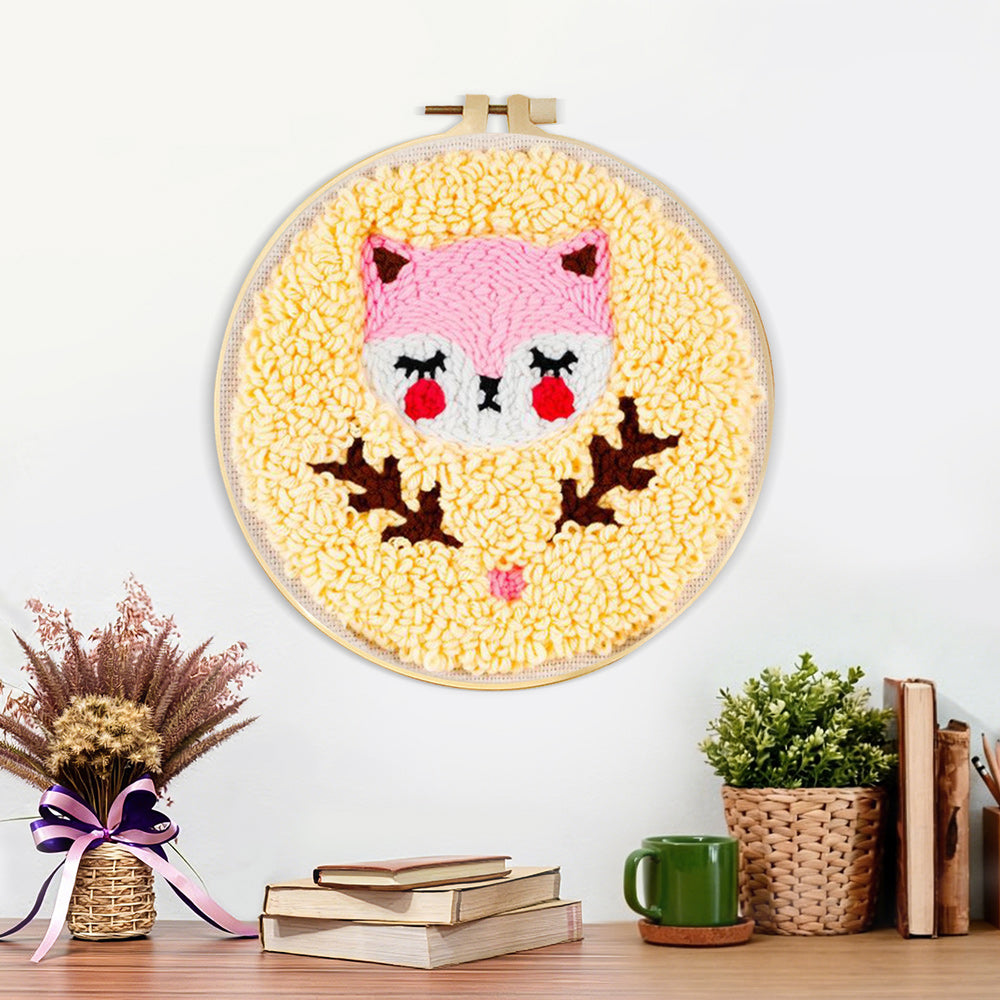 Finished pink baby fox artwork displayed on a wall