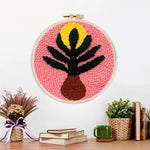 Finished pink background botanical vase artwork displayed on a wall