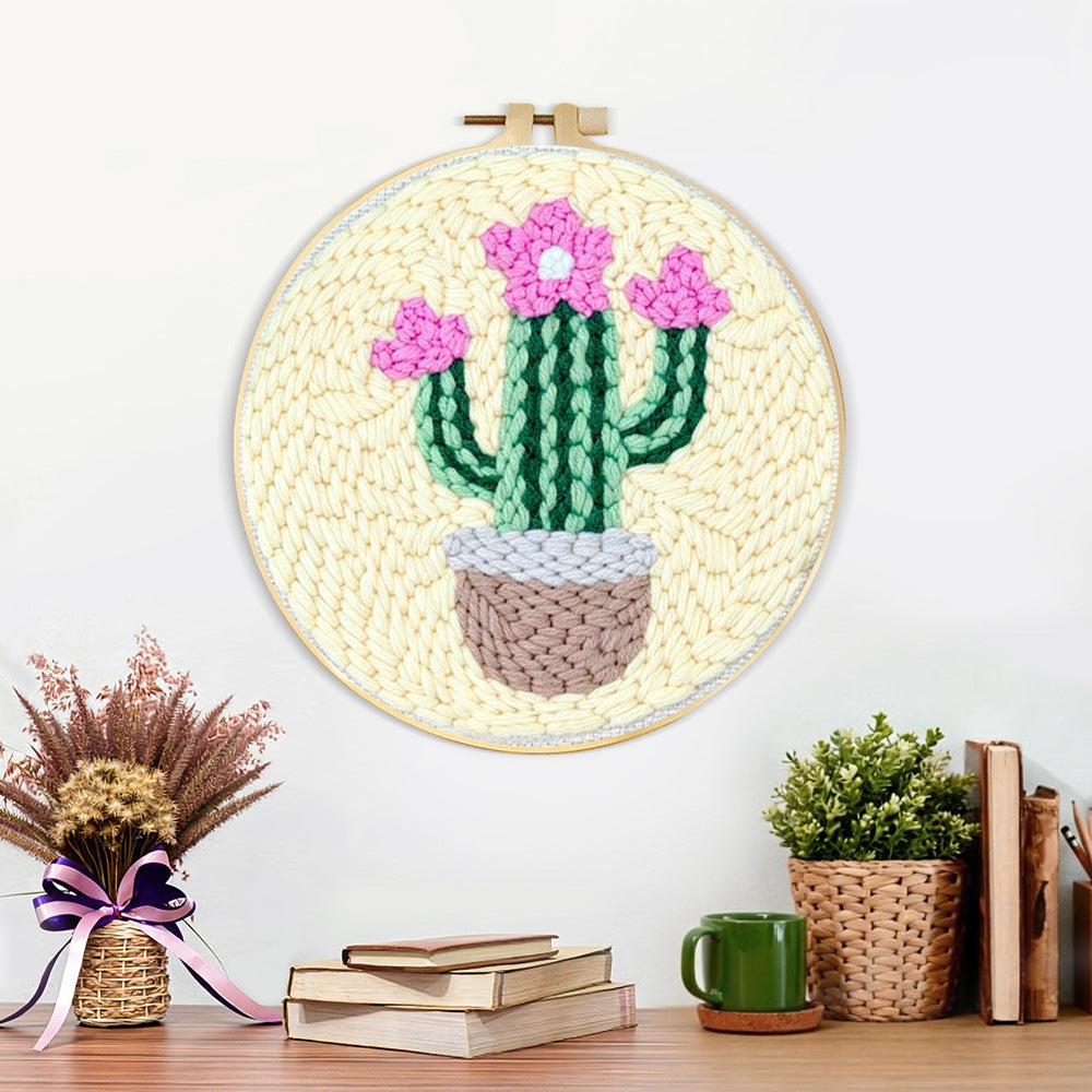 Finished pink blooming cactus artwork displayed on a wall
