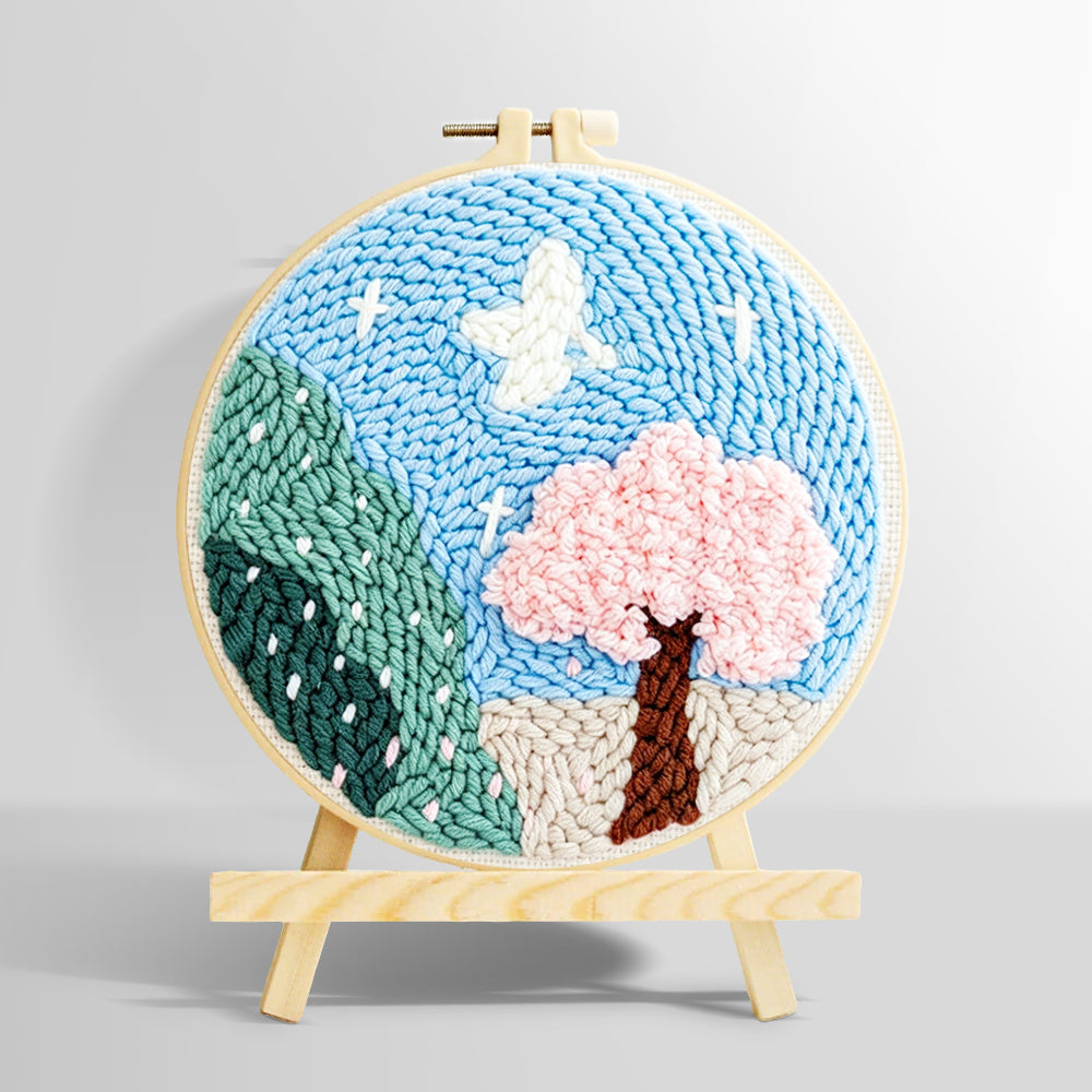 Pink blossom tree and green mountains punch needle kit for beginners