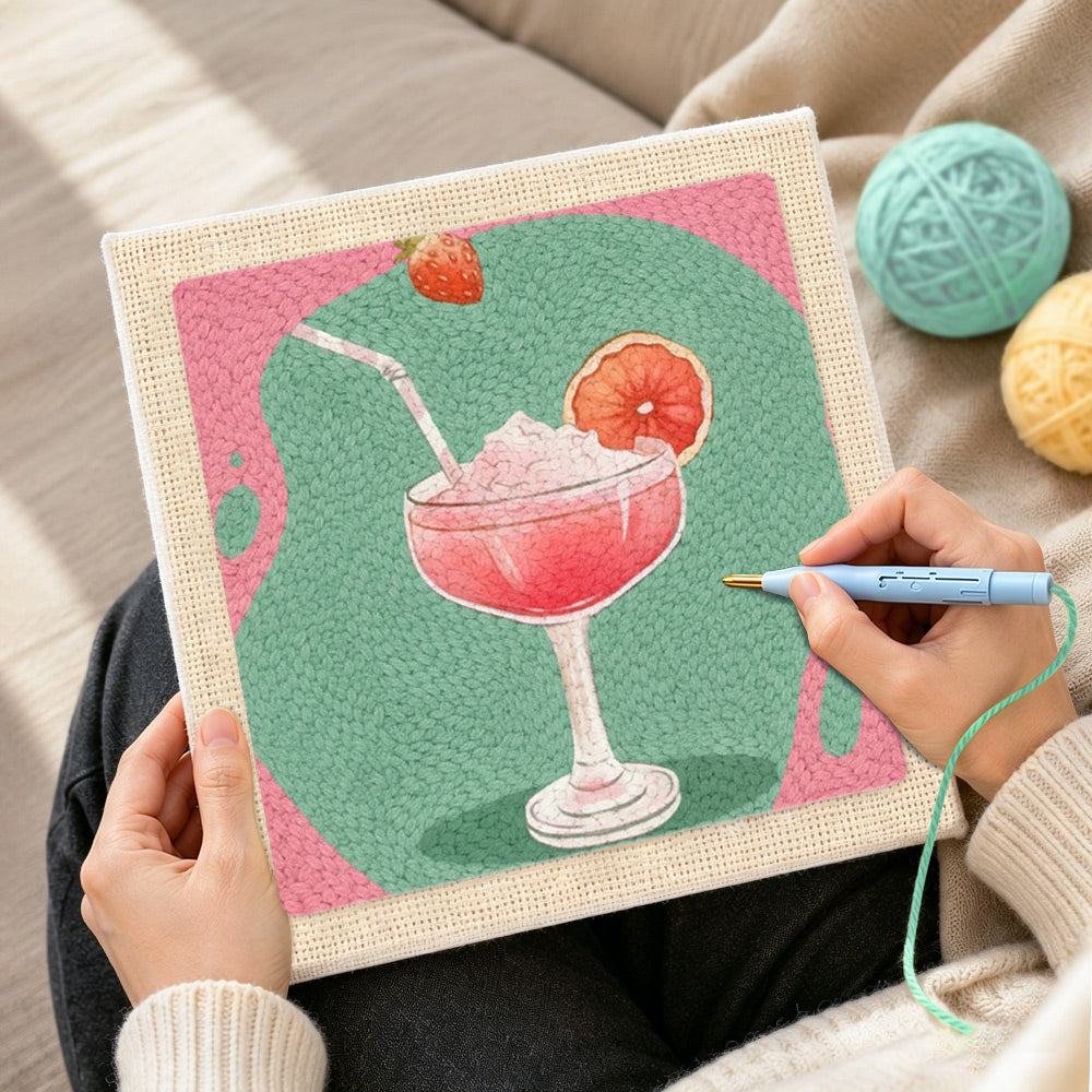 Creating handmade pink cocktail with grapefruit punch needle artwork