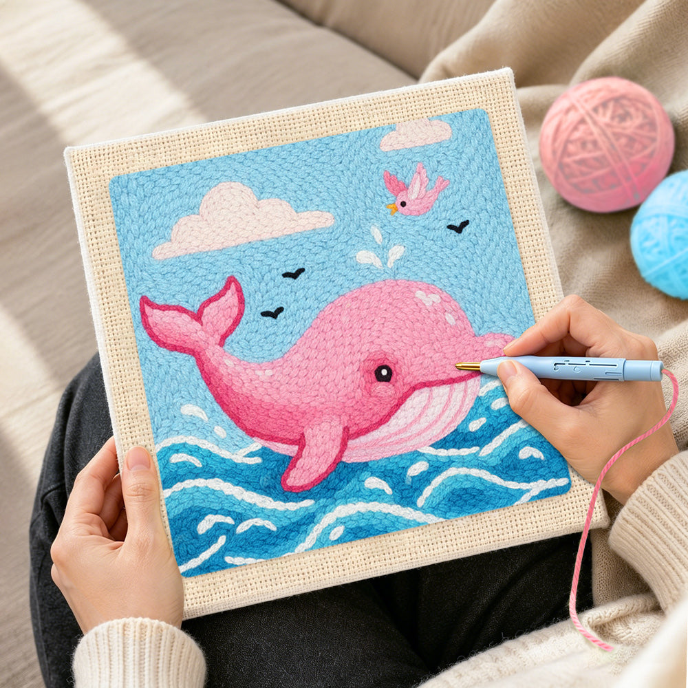 Creating handmade pink dolphin jumping from waves punch needle artwork