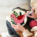 Creating handmade pink flamingo and green plants punch needle artwork