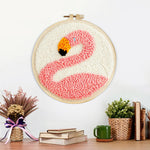 Finished pink flamingo artwork displayed on a wall