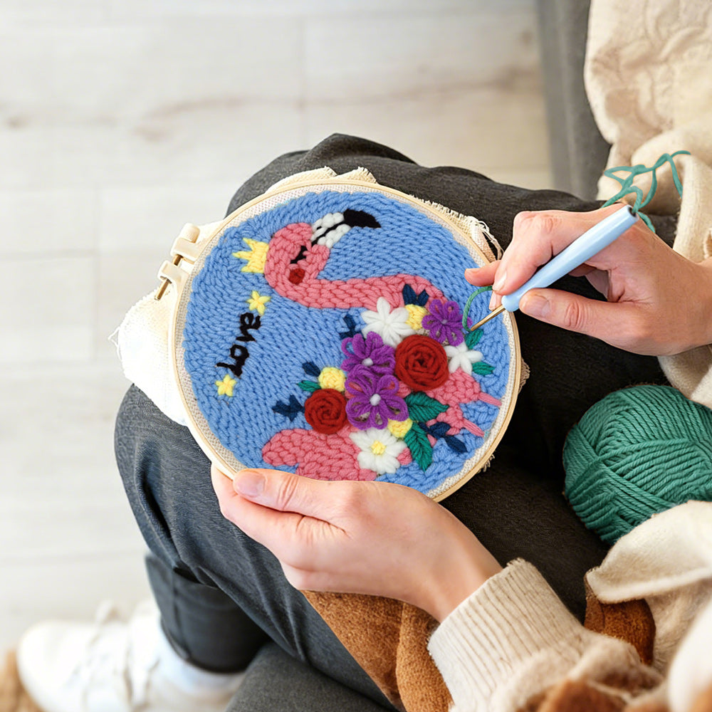 Creating handmade pink flamingo with colourful flowers punch needle artwork