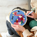 Creating handmade pink flamingo with colourful flowers punch needle artwork