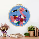 Finished pink flamingo with colourful flowers artwork displayed on a wall