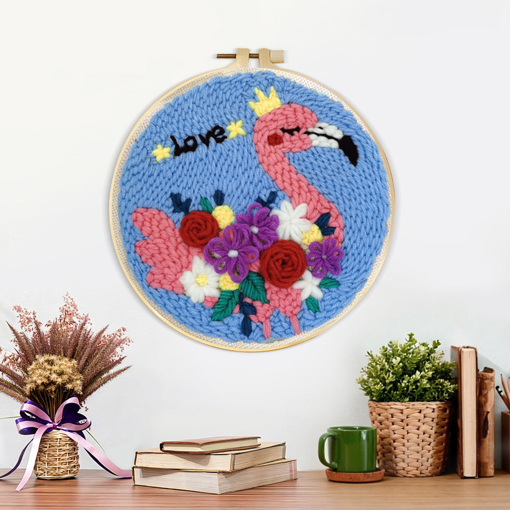 Finished pink flamingo with colourful flowers artwork displayed on a wall