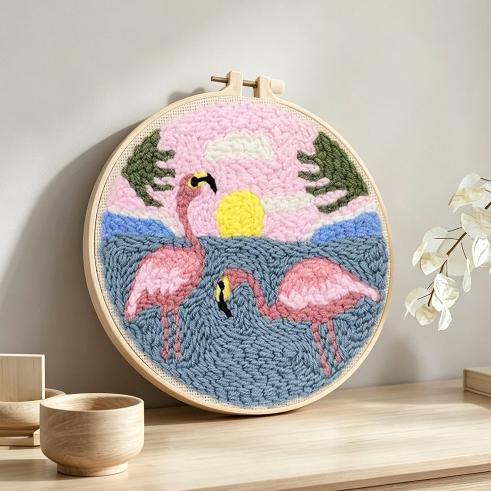 Pink flamingos by the sea punch needle artwork displayed on a table