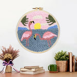 Finished pink flamingos by the sea artwork displayed on a wall