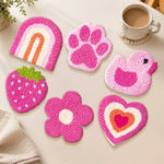 Pink heart, duck and strawberry punch needle coasters used for home decoration