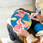 Creating handmade pink lilies punch needle artwork
