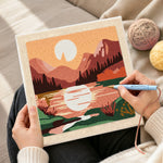 Creating handmade pink mountain sunrise punch needle artwork