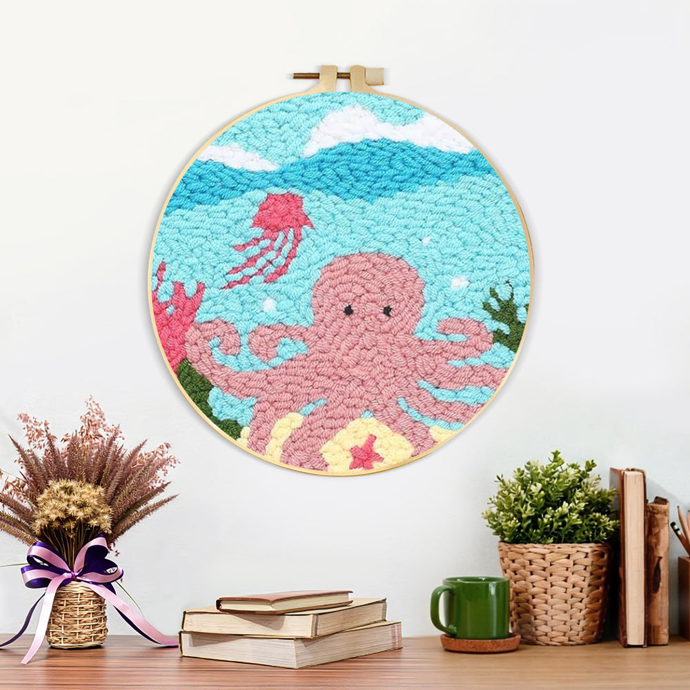 Finished pink octopus artwork displayed on a wall