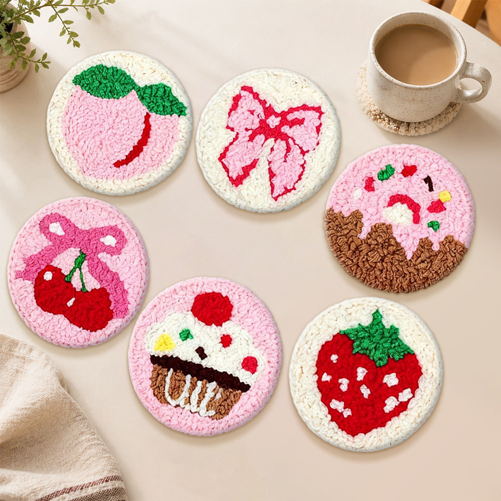 Pink peach, strawberry and cupcake punch needle coasters used for home decoration