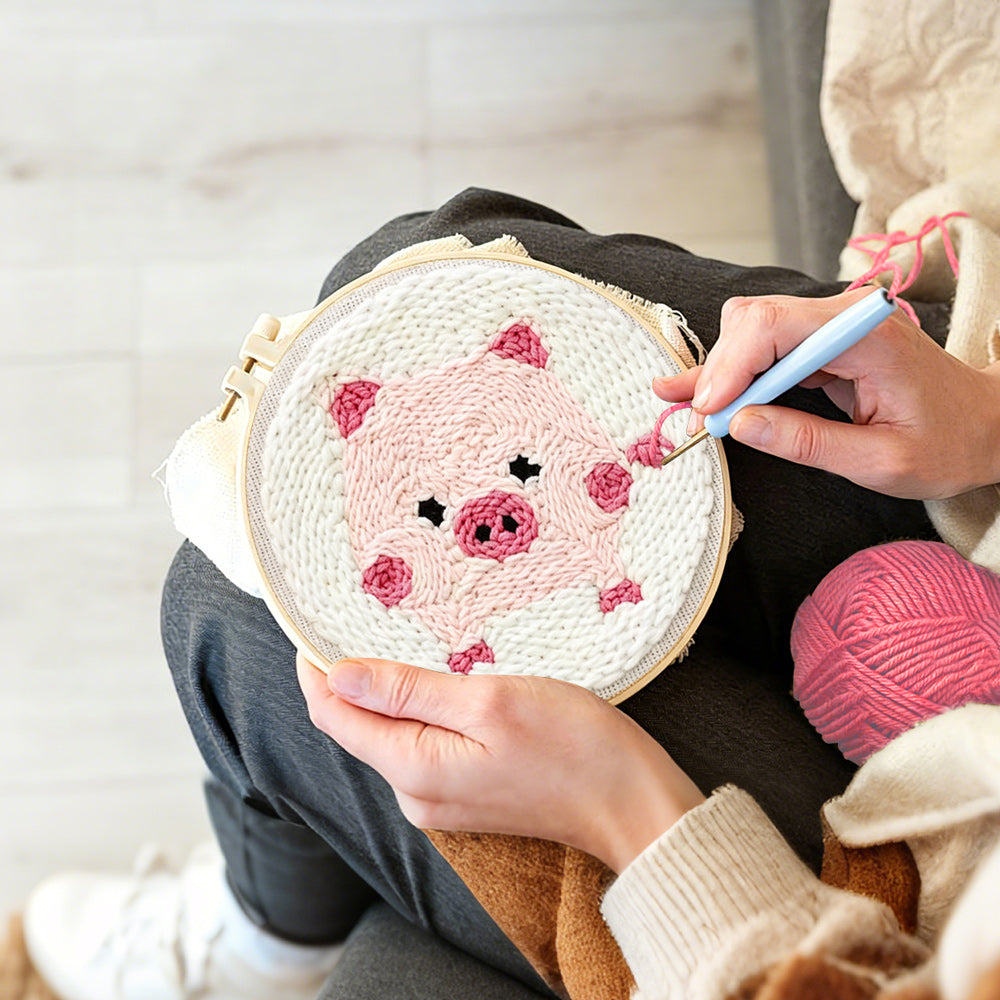 Creating handmade pink piglet punch needle artwork