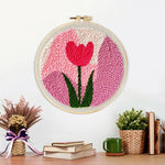 Finished pink tulip artwork displayed on a wall