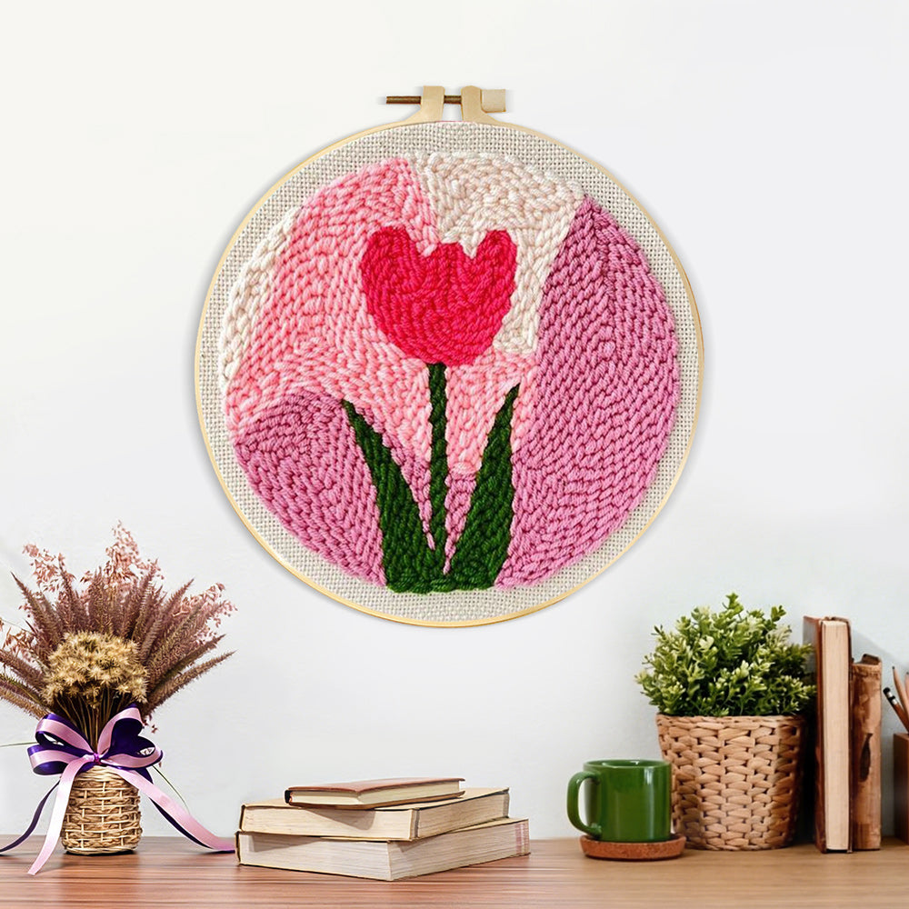 Finished pink tulip artwork displayed on a wall