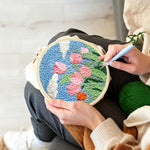 Creating handmade pink tulips under the blue sky punch needle artwork