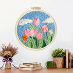 Finished pink tulips under the blue sky artwork displayed on a wall