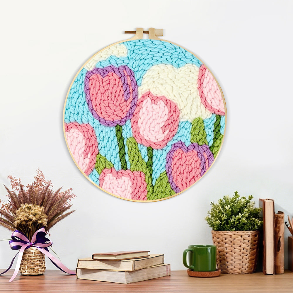 Finished pink tulips under the sky and clouds artwork displayed on a wall