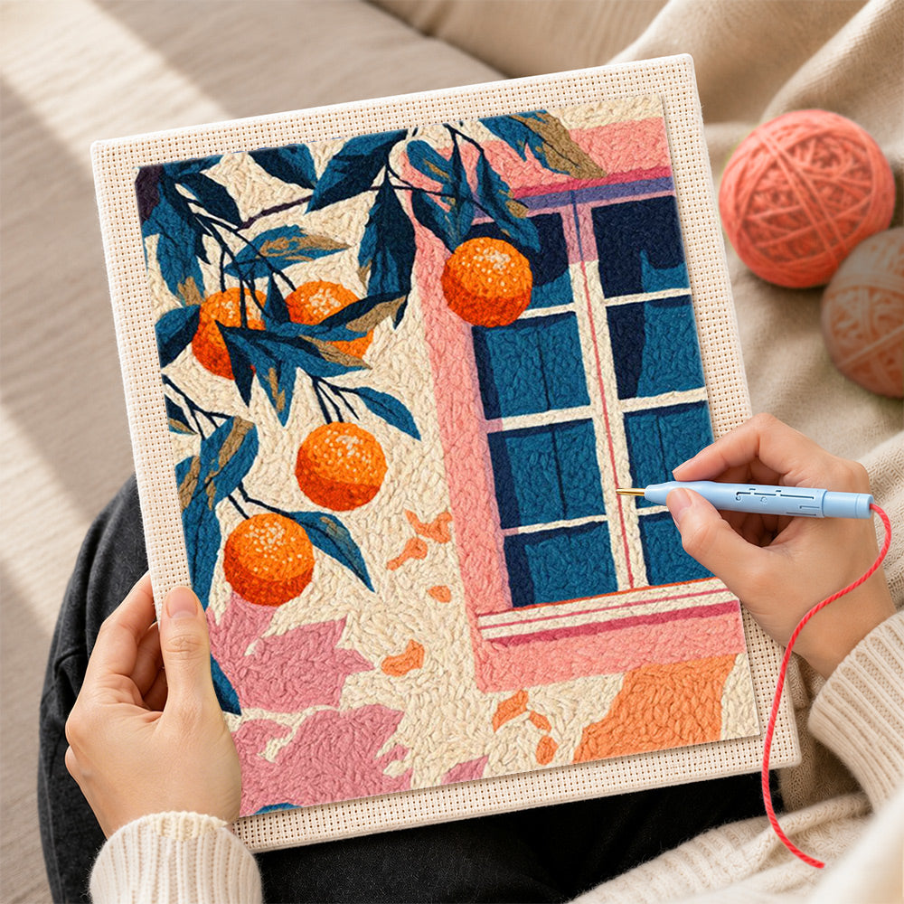 Creating handmade pink window and orange tree punch needle artwork