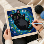 Creating handmade Playful black cat with flowers punch needle artwork