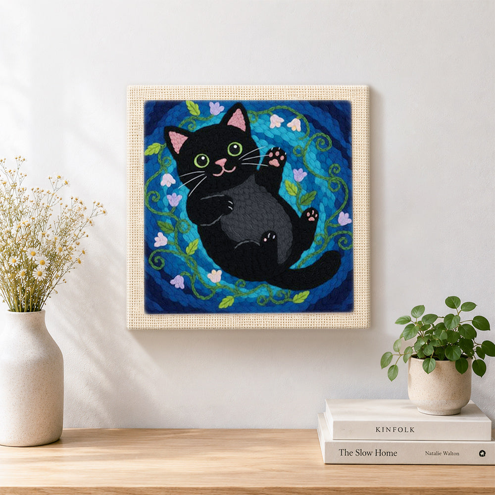 Finished playful black cat with flowers artwork displayed on a wall