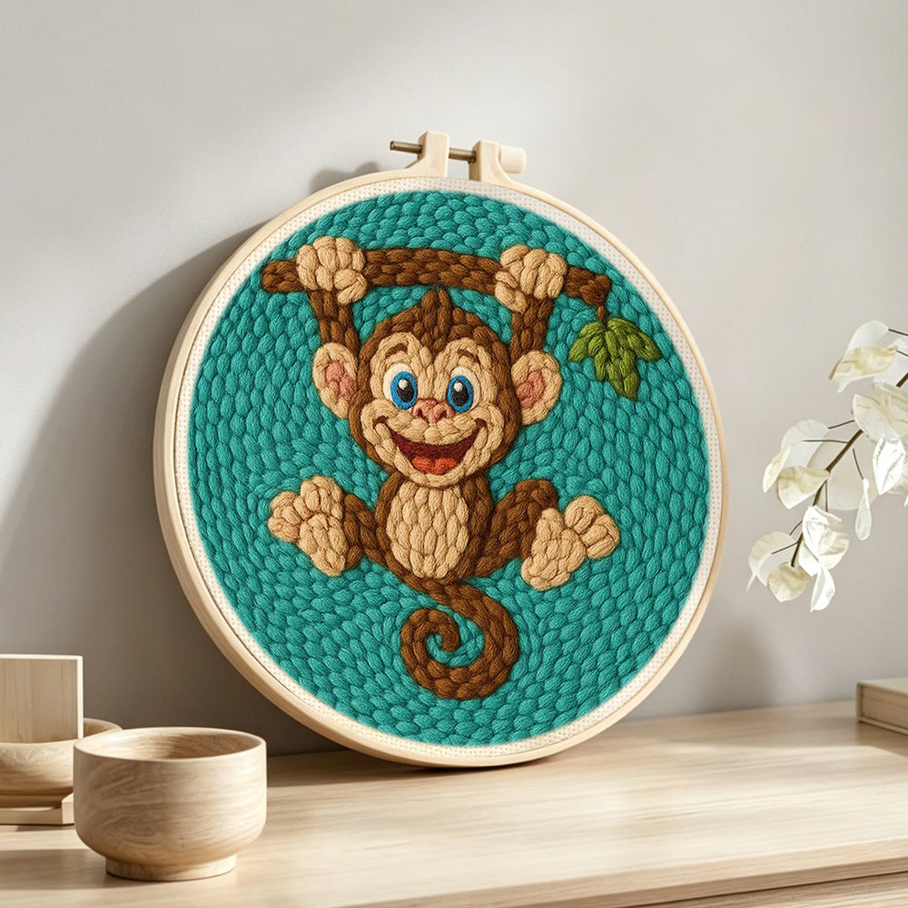 Playful little monkey punch needle artwork displayed on a table