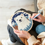 Creating handmade polar bear in mountain forest punch needle artwork