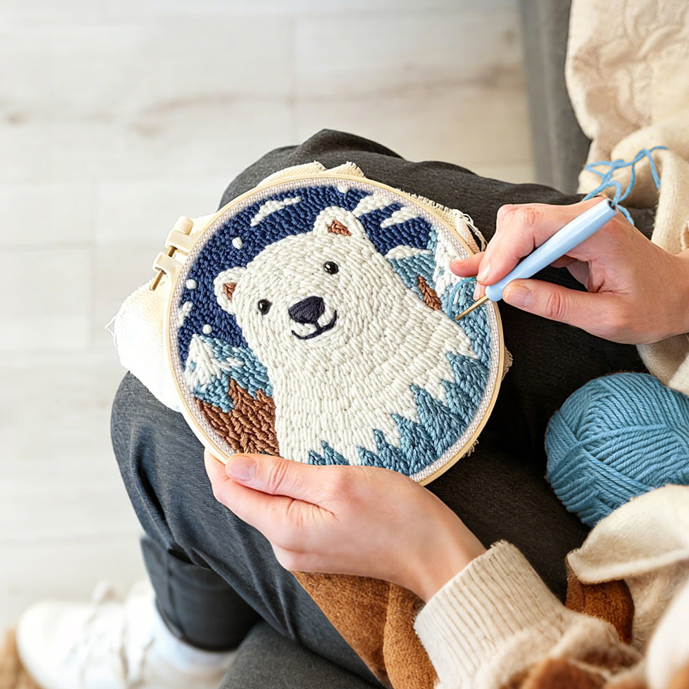 Creating handmade polar bear in mountain forest punch needle artwork