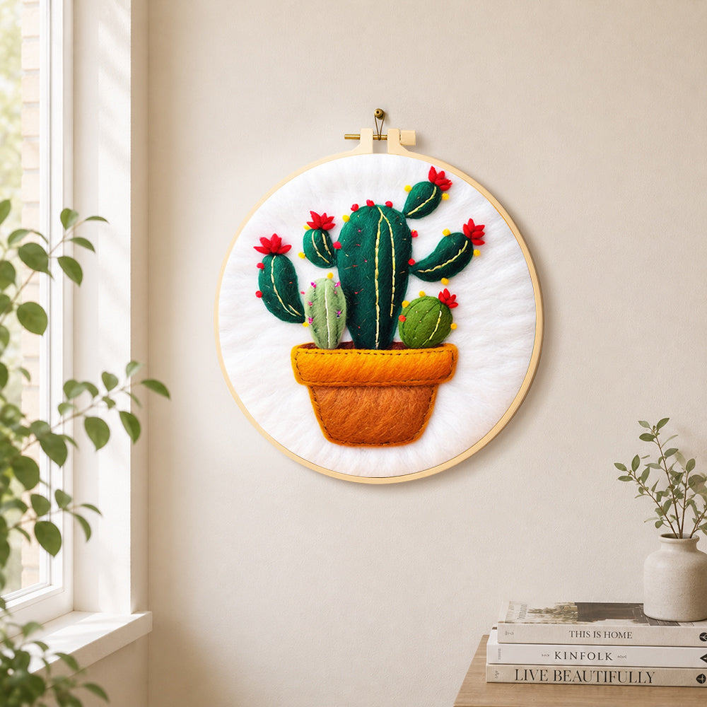 Potted cactus with red flowers needle felt wall art displayed in a bright home interior