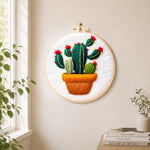 Potted cactus with red flowers needle felt wall art displayed in a bright home interior