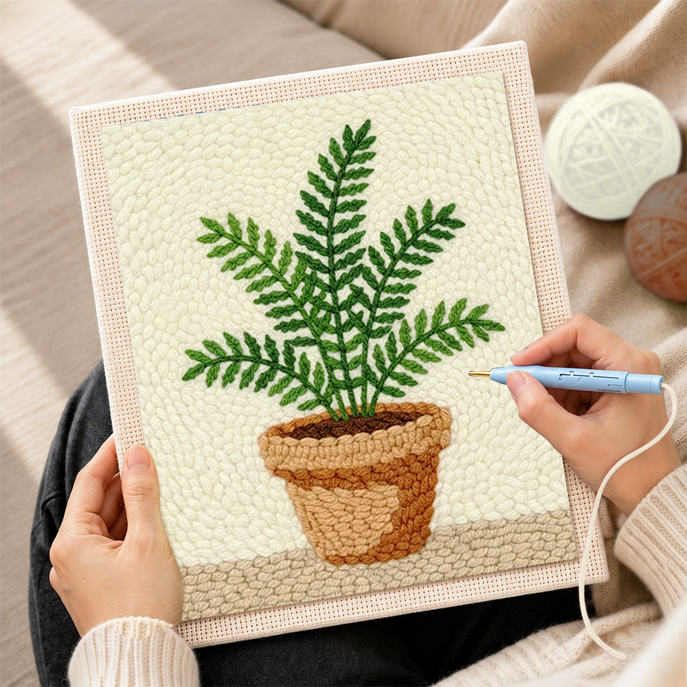 Creating handmade potted green fern punch needle artwork
