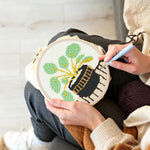 Creating handmade potted green plant punch needle artwork