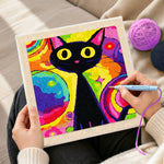 Creating handmade psychedelic rainbow black cat punch needle artwork