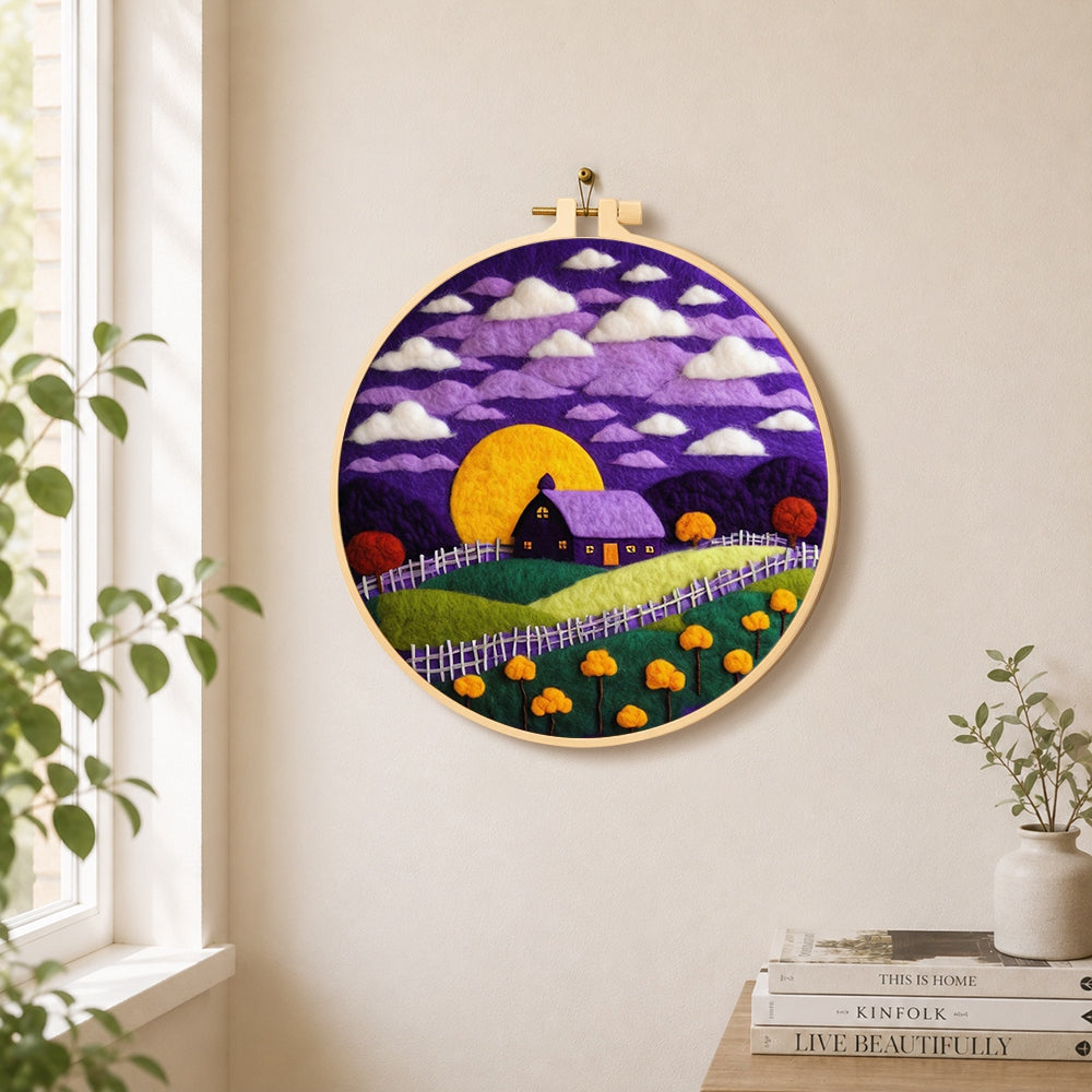 Purple cottage and golden moon needle felt wall art displayed in a bright home interior
