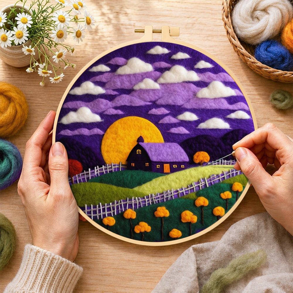 Creating the purple cottage and golden moon wool painting by hand with a felting needle
