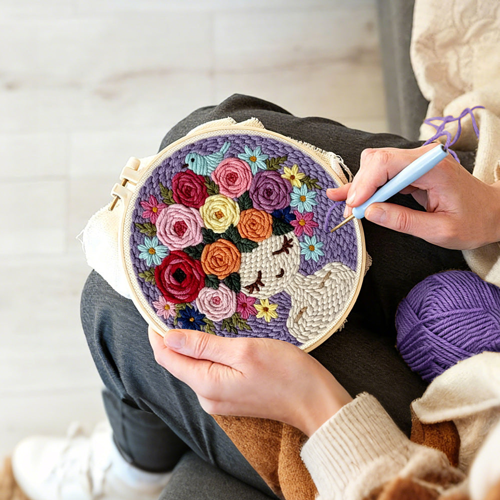 Creating handmade purple floral crown girl punch needle artwork