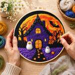 Creating the purple haunted house with little ghosts wool painting by hand with a felting needle