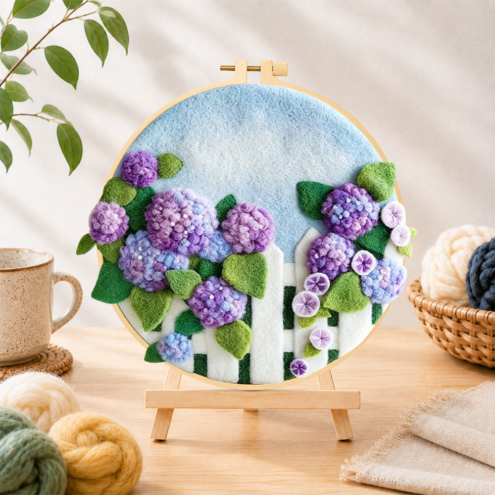 Finished purple hydrangeas on fence needle felting displayed on a wooden easel