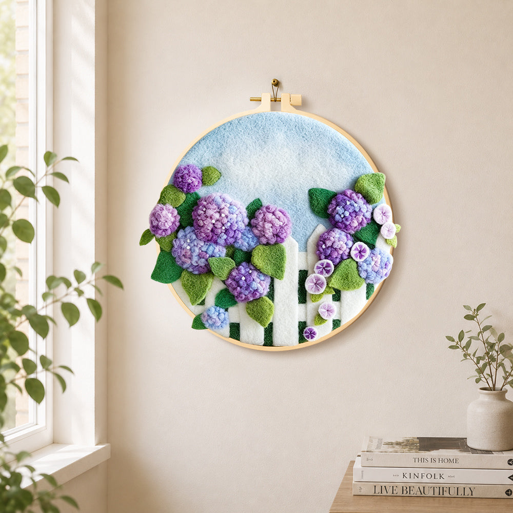 Purple hydrangeas on fence needle felt wall art displayed in a bright home interior