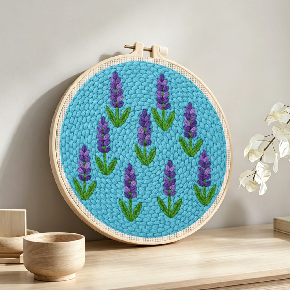 Purple lavender pattern punch needle artwork displayed on a table
