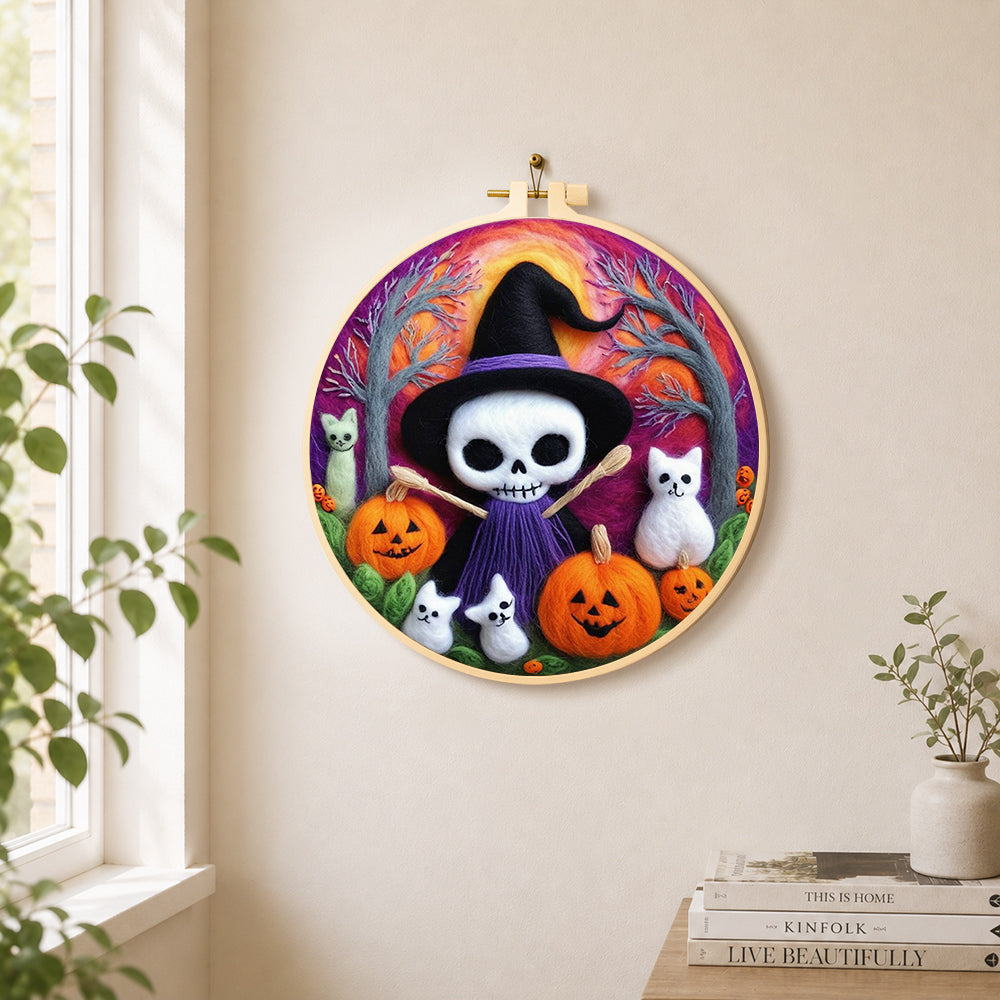 Purple skull witch with broom needle felt wall art displayed in a bright home interior