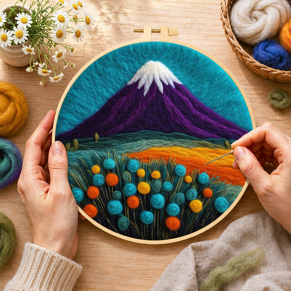 Creating the purple volcano and flowers wool painting by hand with a felting needle