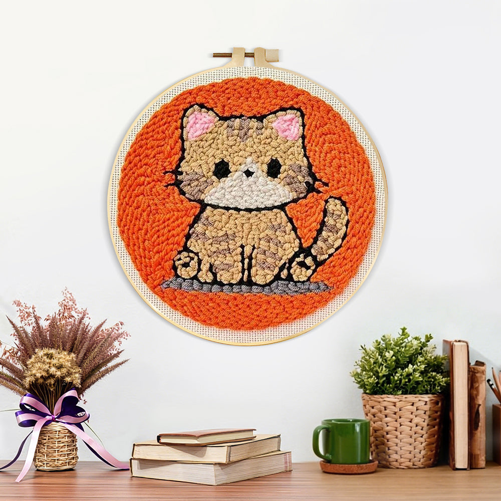 Finished quiet little orange cat artwork displayed on a wall