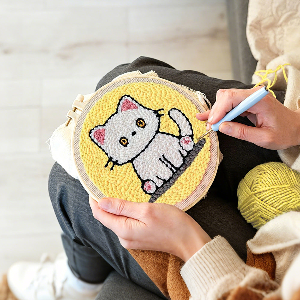 Creating handmade quiet little white cat punch needle artwork