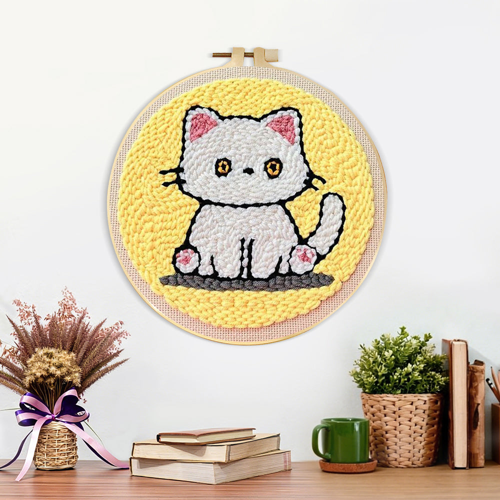 Finished quiet little white cat artwork displayed on a wall